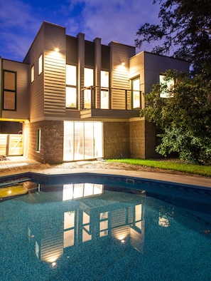 View of Living room and bedroom overlooking pool