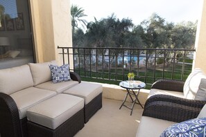 Bedroom deck with view of pool