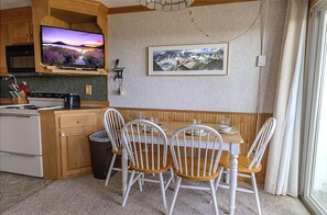 The kitchen table, with 33" smart TV, is a great gathering place!
