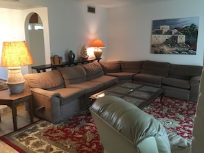Large comfortable living room with large screen TV