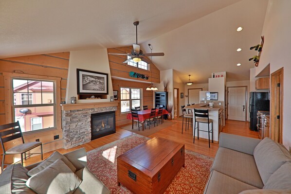 Discovery Court at Rendezvous - a SkyRun Winter Park Property - Spacious Living room with deck off to left 