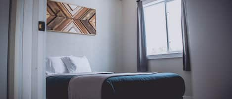 Main floor bedroom with queen bed.