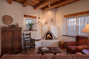 Living room with woodburning Kiva fireplace