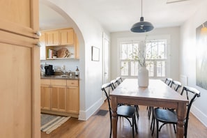 Stocked kitchen and dining space for six