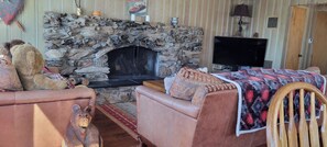 Large gathering room connected to the kitchen and door to rear deck.