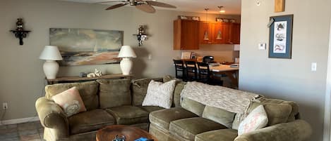 Living Room, comfortable sectional sofa with queen bedand antique coffee table. 