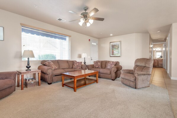 Beautiful living room with two Lazy-boy chairs, love seat, and hide-a-bed sofa