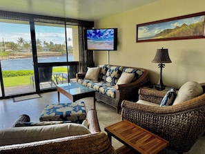 Gaze at the ocean from our spacious living room or enjoy a show on the 55" TV