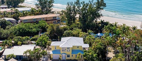 Welcome to Surfside AMI, the beloved yellow house next to the beach!