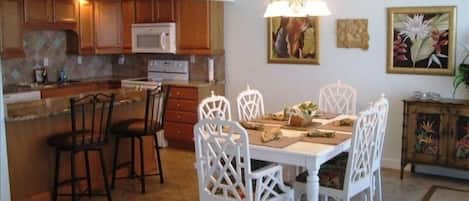 Dining room/kitchen, next to the den, with floor-to-ceiling windows & balcony!