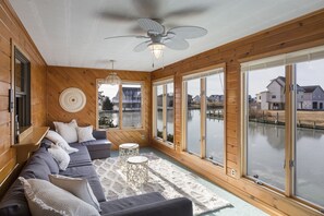 A spectacular Waterfront Sunroom lines the back of this awesome Home.