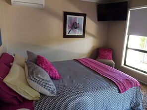 Comfortable Queen Bed with your own private wall mounted TV + Airconditioning