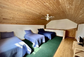 Spacious loft area with 2 comfortable twin beds and another comfy queen bed. 