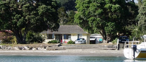 the bach from a kayak at high tide. 