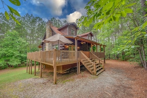 Privately situated on acres of wooded property and minutes to town/dining