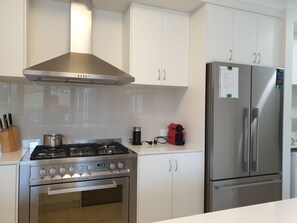 Stove and refrigerator in kitchen