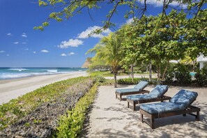 Relax on the beach in your private loungers