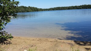 Kids love to swim and play at sandy beach at lakefront that has gradual depth.