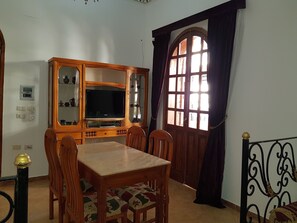 Dining area with doors to terrace.