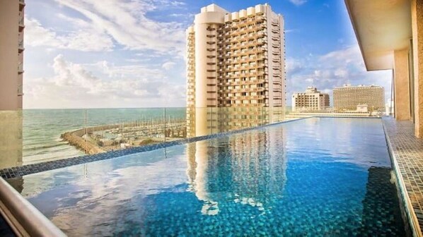 Private rooftop pool overlooking Hilton Marina and Gordon Beach