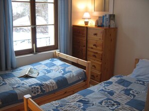 The blue bedroom with view toward the cow pastures