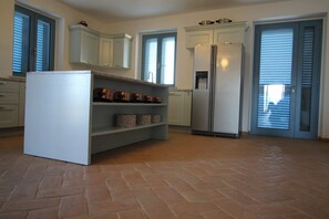 The new kitchen with granite worktops and American style fridge freezer