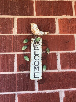 You've arrived when you see the "Welcome" sign to the right of the front door. 