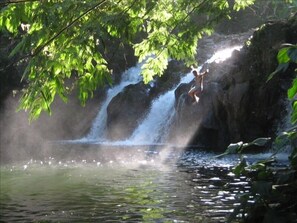 Swim pond in gorge behind house, with three waterfalls. 