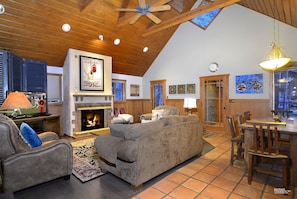 The great room has a wonderful gas fireplace and access to the deck