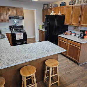 kitchen with bar seating for 3