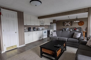 The spacious living room is great for relaxing and has one queen sofa bed.