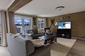 Cozy up to the electric fireplace next to the 51" TV.