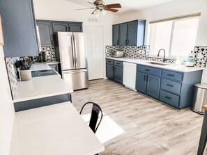 Recently remodeled kitchen with quartz counters & stainless steel appliances