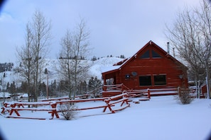 Side of house with mountains in background