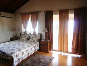 bedroom 1 with porch featuring fantastic water and coastline views.