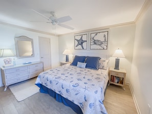 The master bedroom features a king bed and stunning ocean views for a serene coastal retreat