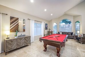 A fun game room with pool table. 