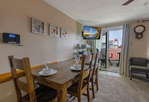 This lovely property features a large kitchen table and a 42" TV.