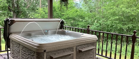 Gorgeous Alpine Hot Tub with Fountains Located on The Back Covered Deck.