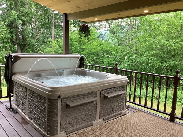 Gorgeous Alpine Hot Tub with Fountains Located on The Back Covered Deck.