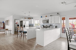 Fully Stocked Kitchen With All The Staples Including Foils, Wraps, Spices, and Starter Coffee Station.