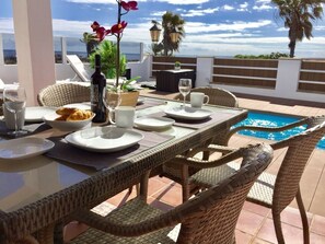 Outdoor dining by the pool