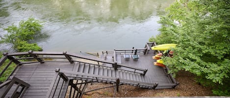 Welcome to Kingfisher with a deck leading the Mountain Fork River!