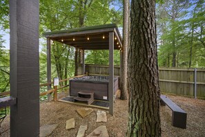 Huge covered hot tub with string lights!