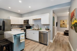 Generous kitchen with brand-new stainless appliances and full-equipped with everything you'll need for any size meal! 