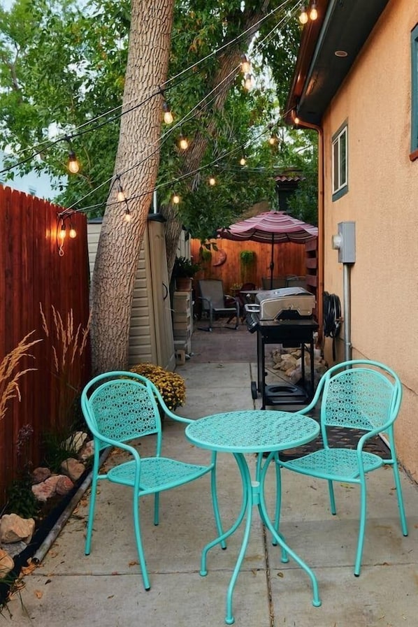 Cafe seating in your own private section of the backyard of the main house. 