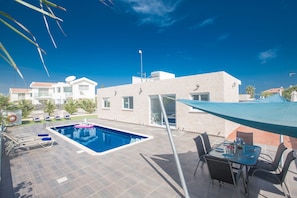 Spacious garden with barbecue, seating area, sunloungers, lawn and Private Pool