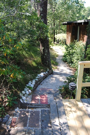 An outdoor path provides a second option for accessing the home's lower level.