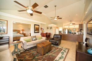 Living room looking into second bedroom suite.  Sliding doors provide privacy 