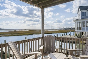 Enjoy morning coffee while watching the Herons & Egrets dance over the water.